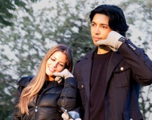 Couple using hi-call bluetooth gloves with builtin phone headset