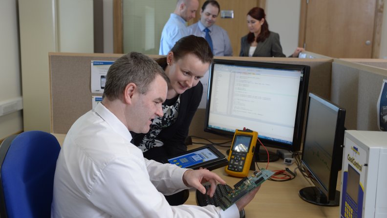 Liam Mullane and Rosemarie Sheehy at work in the Software Development Department at Dairymaster in Kerry