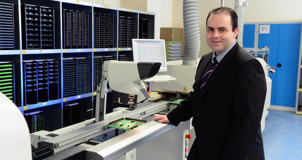 Dr Edmond Harty in the Electronic Printed Circuit Board Department at Dairymaster