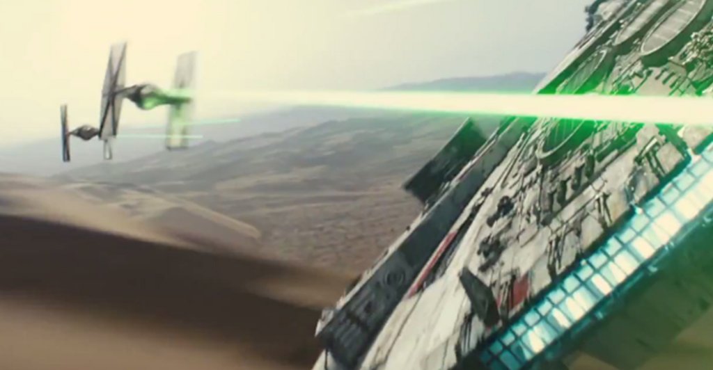 Millenium Falcon in a dogfight with TIE fighters in a scene from Star Wars: The Force Awakens