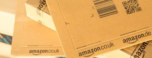 Paris France - February 08 2017: Amazon Prime Parcel Packages closeup. Amazon is an American electronic commerce and cloud computing companybased in Seattle Started as an online bookstore Amazon is become the most important retailer in the United States