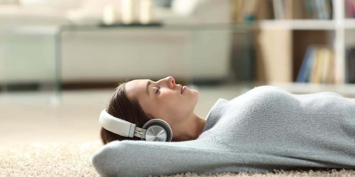 girl listening to streaming music on headphones
