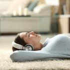 girl listening to streaming music on headphones