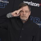 FILE - Mark Hamill salutes as he arrives at the world premiere of "Star Wars: The Rise of Skywalker" in Los Angeles on Dec. 16, 2019. When air raid alarms sound in Ukraine, they also trigger a downloadable app that has been voiced by “Star Wars” actor Mark Hamill. With his gravely but also calming baritone, he urges people to take cover. He also tells them when the danger has passed, signing off with “May the Force be with you.” In an interview with The Associated Press, the actor said he’s admiring Ukraine's resilience from afar in California.(Jordan Strauss/Invision/AP, File)