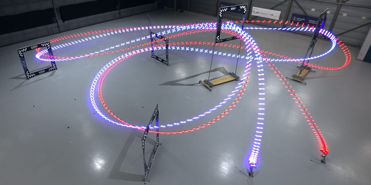 Undated handout photo issued by the University of Zurich of an AI-trained autonomous drone (in blue) which managed the fastest lap overall, half a second ahead of the best time of a human pilot. Issue date: Wednesday August 30, 2023.
